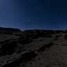 Moonlit kivas & cliff face at Pueblo Bonito